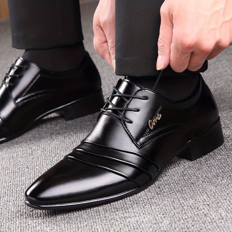 Man wearing black pointed-toe lace-up shoes with tailored trousers