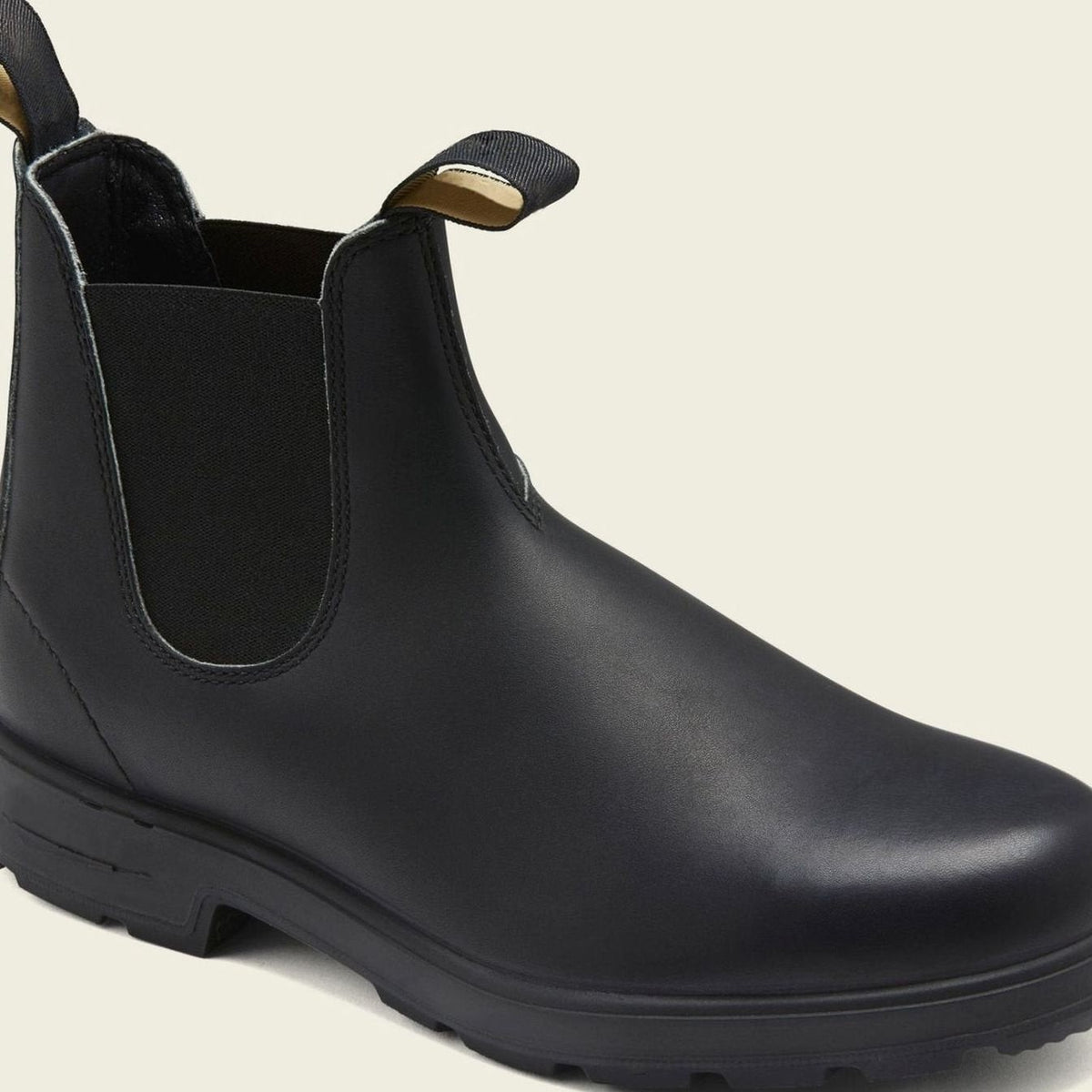 Sleek black leather Chelsea boots with elastic panel and pull-tab detail