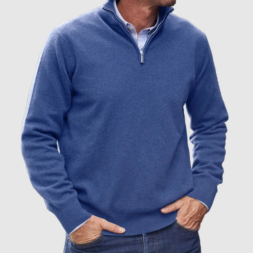 Denim blue quarter-zip pullover worn with a pale blue shirt and jeans