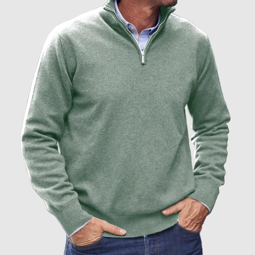 Sage green quarter-zip jumper layered with a blue shirt underneath