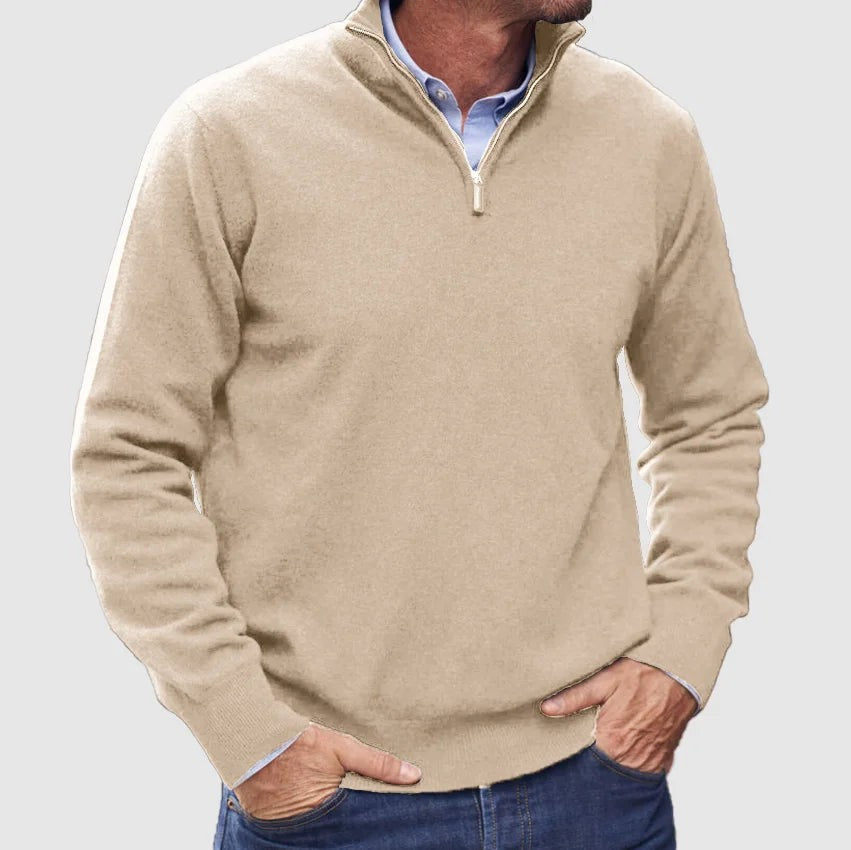 Beige quarter-zip knit pullover styled with denim jeans and a shirt collar