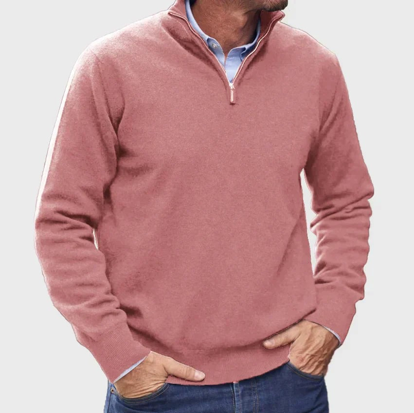 Dusty pink quarter-zip jumper worn over a pale blue button-down shirt