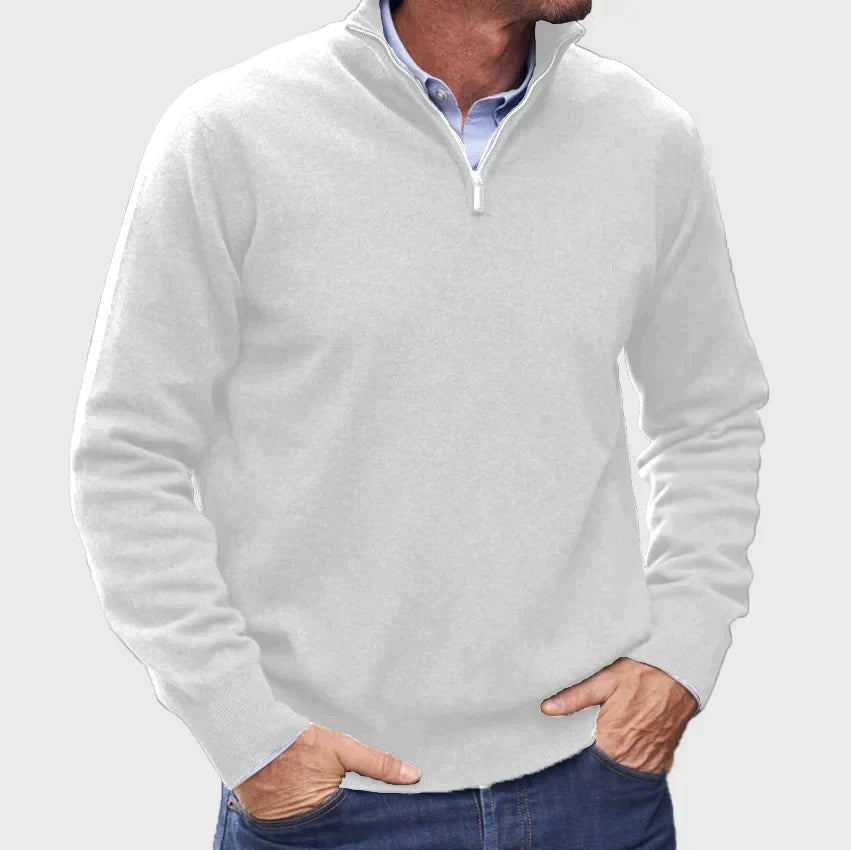Light grey quarter-zip knitted jumper layered with a blue shirt collar