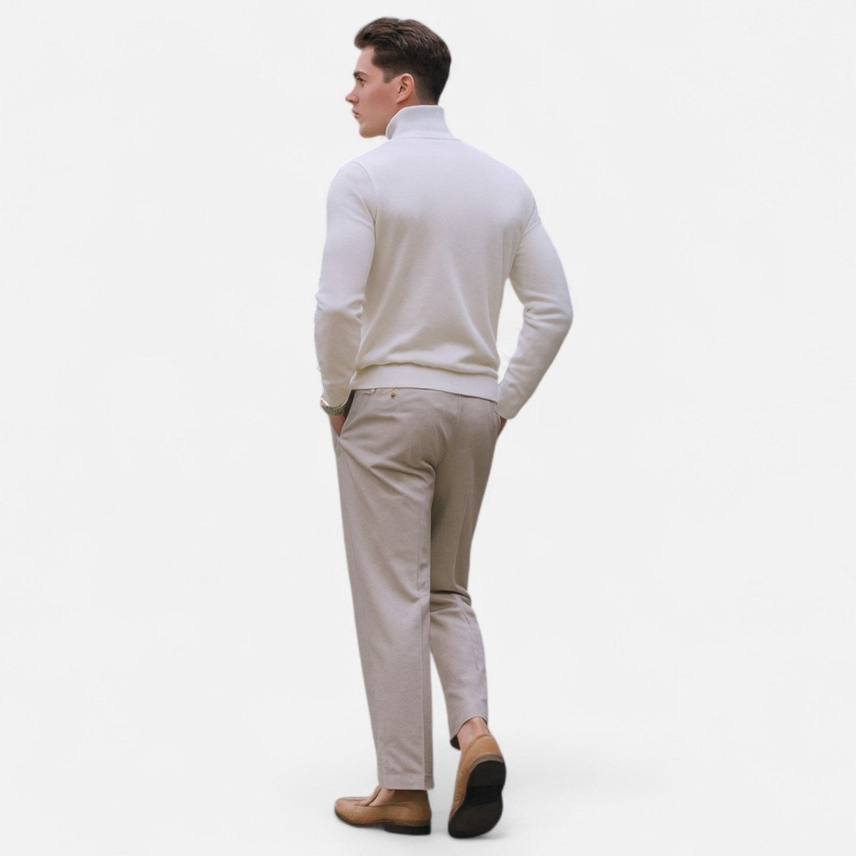 Rear view of cream half-zip jumper paired with beige trousers