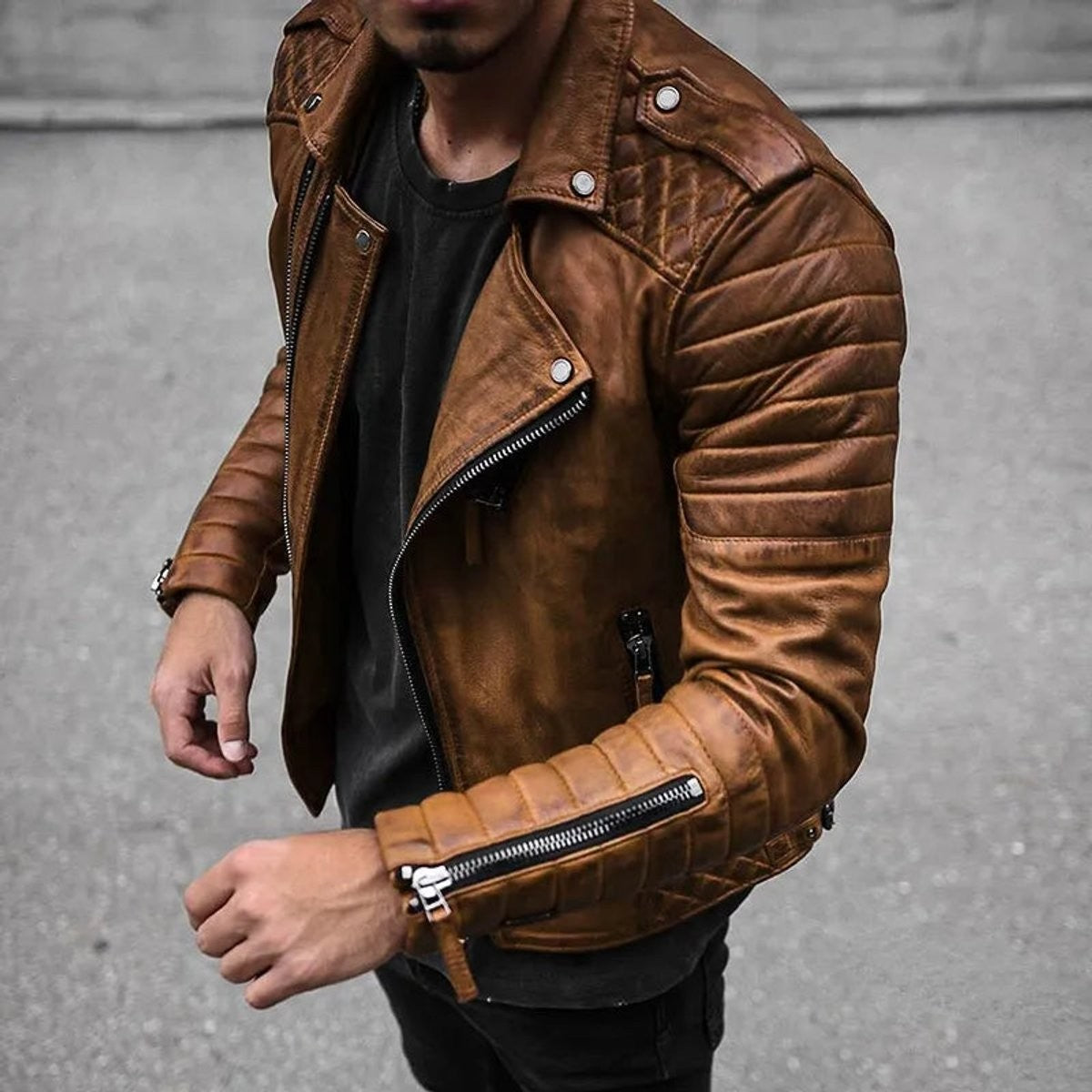 Tan quilted faux leather biker jacket worn with black t-shirt and jeans