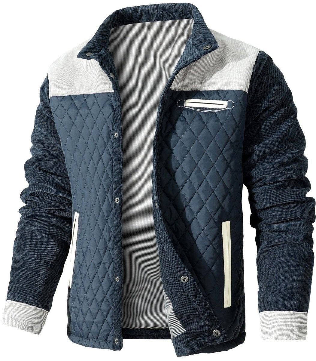Navy diamond-quilted jacket with grey corduroy shoulder panels and cuffs