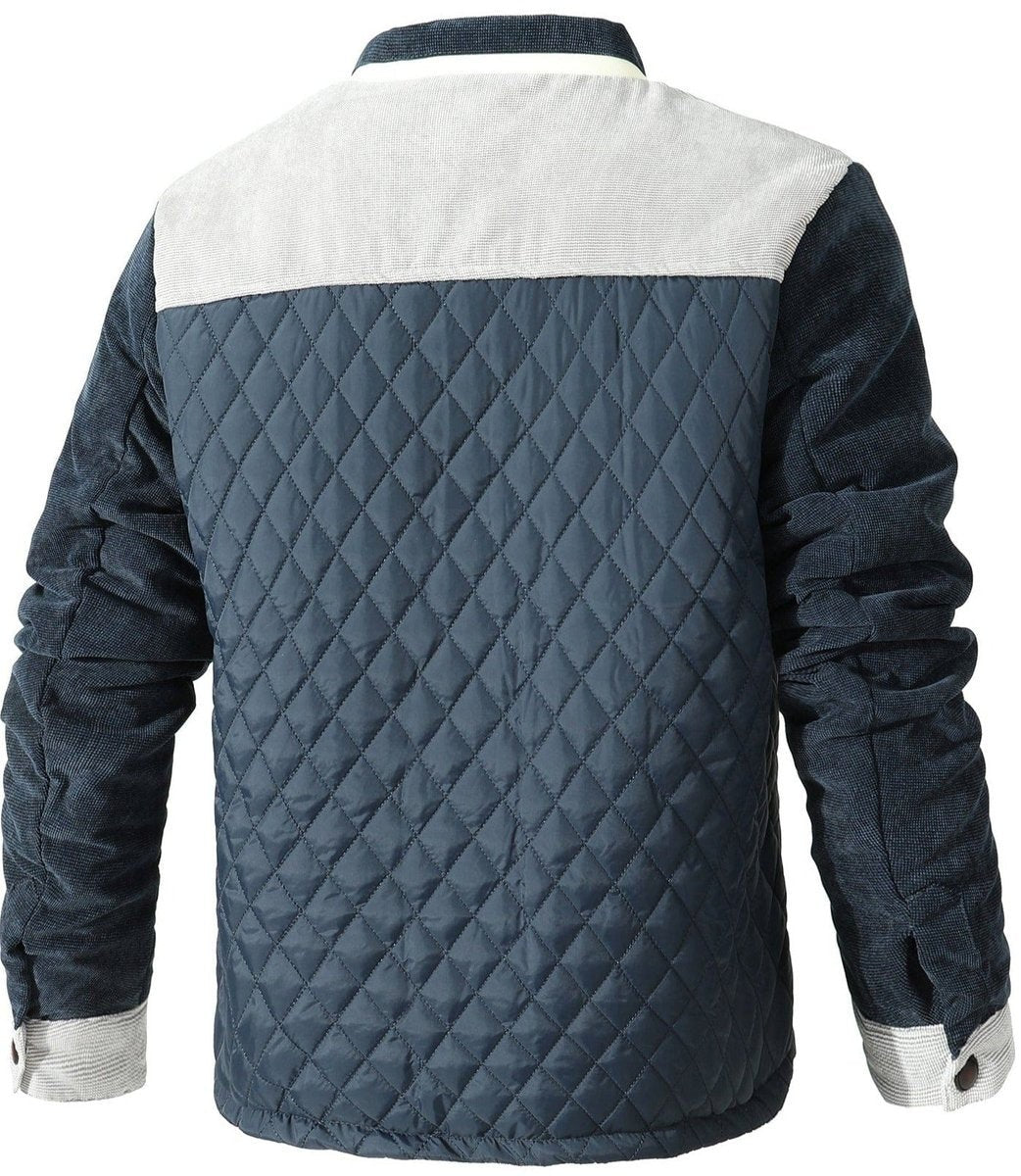 Rear view of navy quilted jacket showing grey corduroy yoke detailing