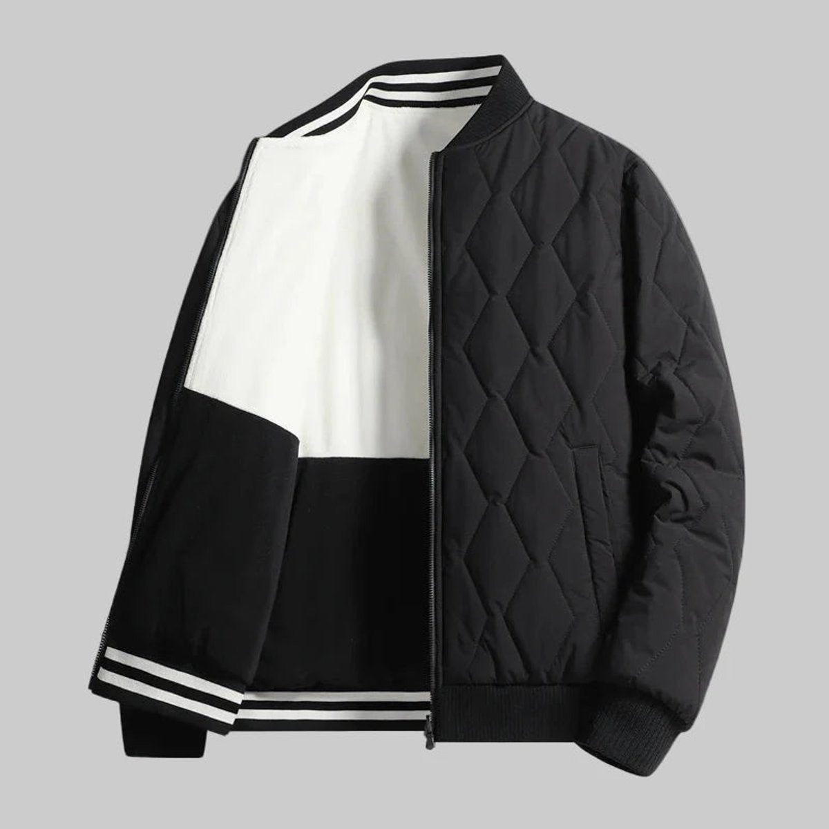 Black quilted bomber jacket showing fleece-lined sleeves and striped cuffs