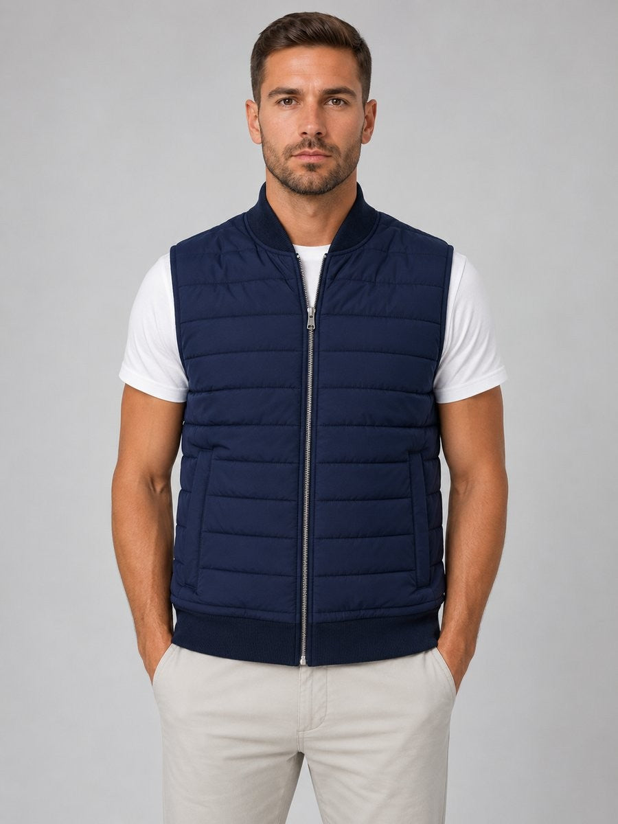 Navy quilted gilet with knitted collar worn over a white T-shirt