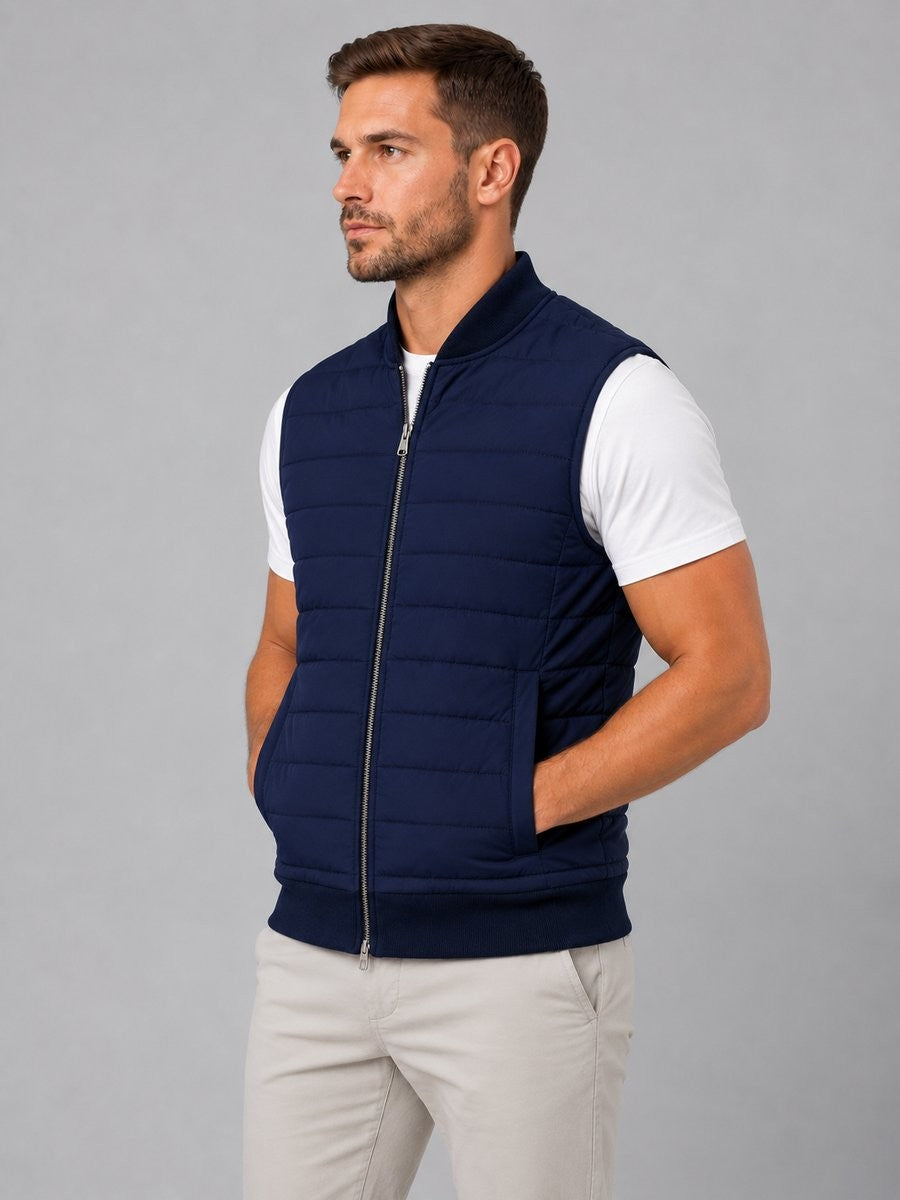 Side profile of navy quilted vest with full-zip and knitted trims