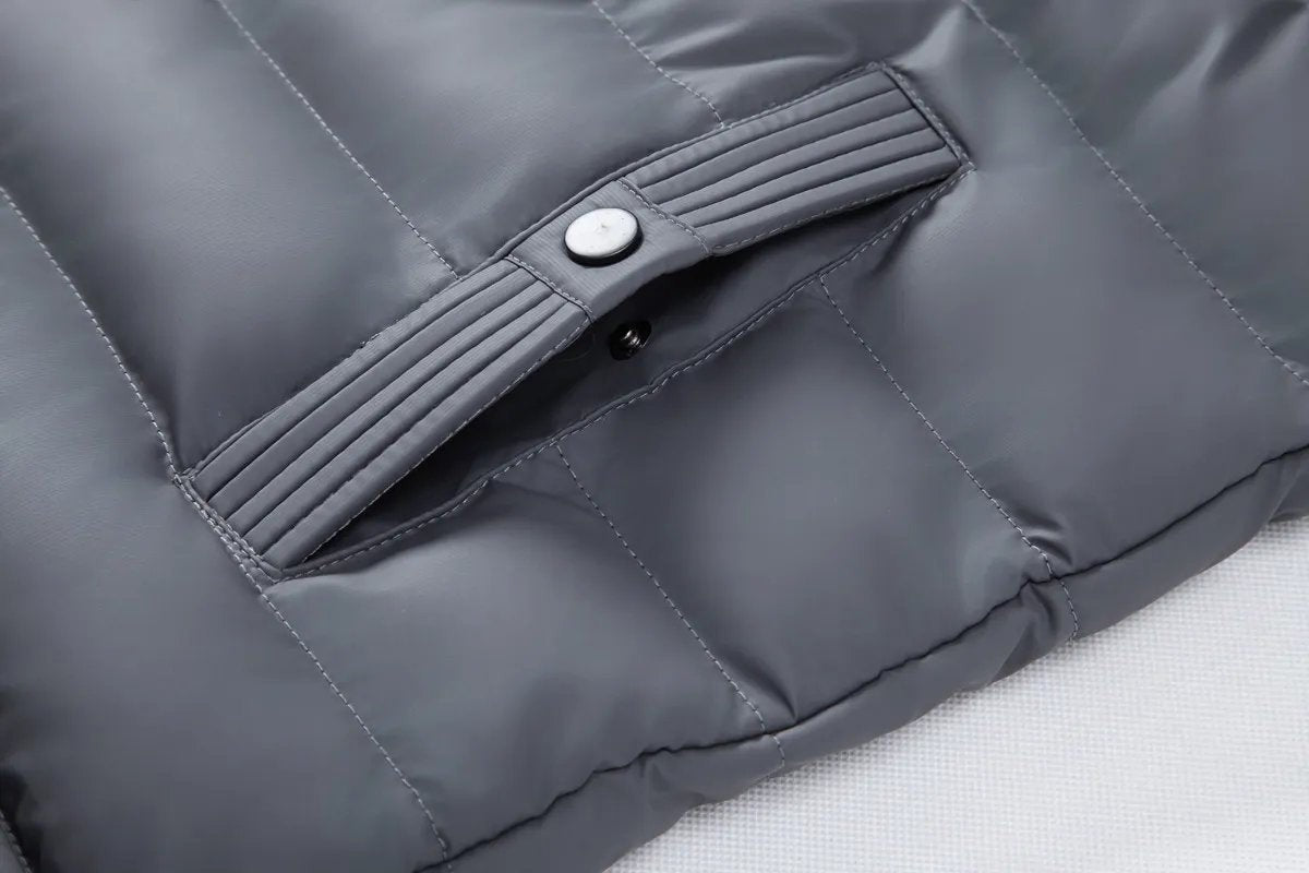 Ribbed popper pocket fastening detail on grey quilted bomber jacket