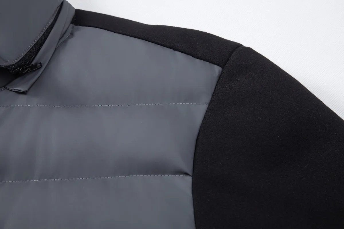 Shoulder panel where quilted grey fabric meets black jersey sleeve