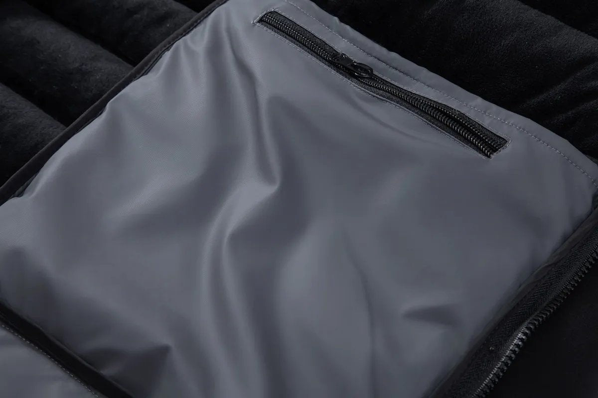 Zipped chest pocket detail inside grey puffer jacket lining