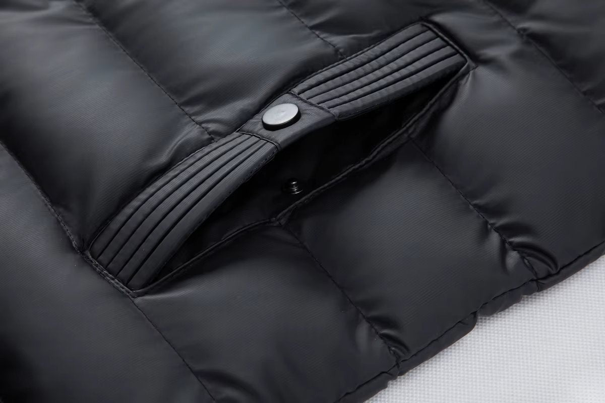 Ribbed popper-fastened pocket detail on black quilted bomber jacket
