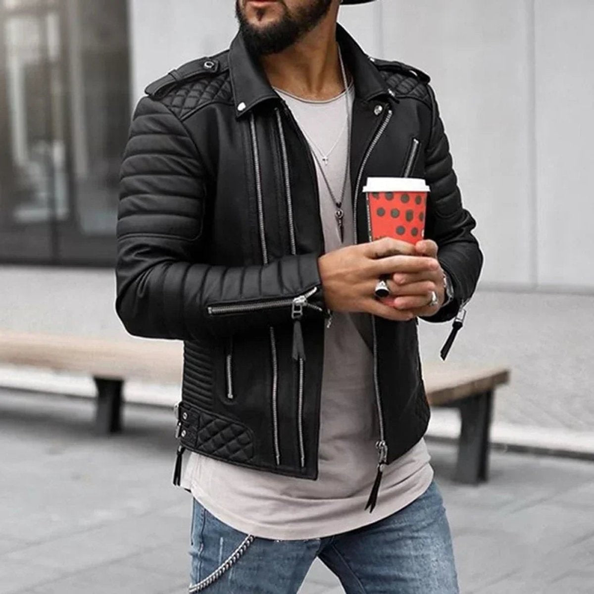 Black quilted-shoulder faux leather biker jacket styled with jeans and layered necklaces