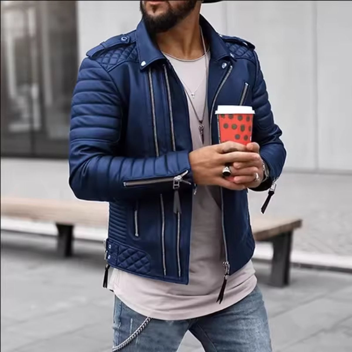 Navy quilted-shoulder faux leather biker jacket paired with a grey t-shirt and jeans