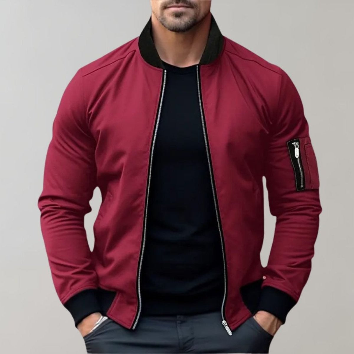 Men's burgundy zip-up bomber jacket styled over a black t-shirt
