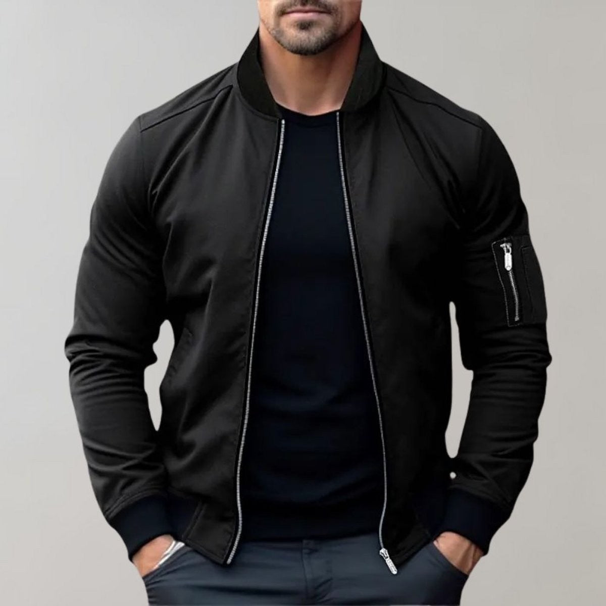 Black bomber jacket with ribbed collar and cuffs worn over black t-shirt