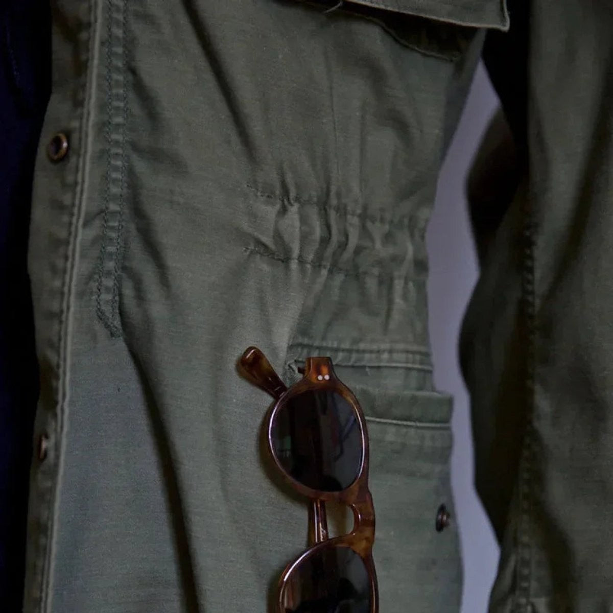 Charcoal grey field jacket with four-pocket design and stand-up collar