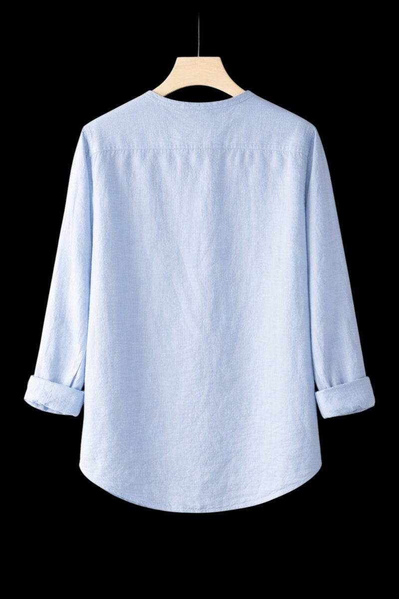 Rear view of pale blue linen Henley shirt showing relaxed silhouette