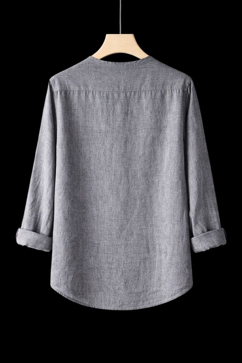 Rear view of grey linen Henley shirt with folded cuffs on hanger
