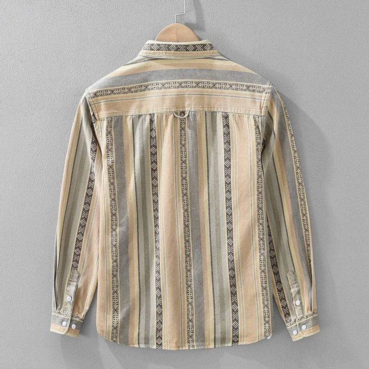Rear view of beige striped flannel shirt showing Aztec woven trim panels