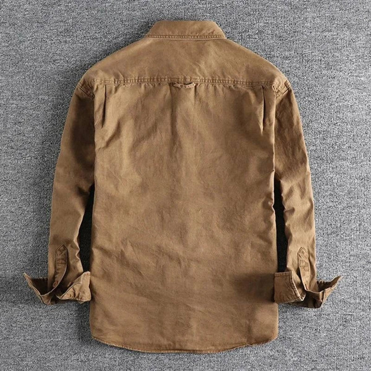 Rear view of relaxed-fit khaki overshirt showing yoke and cuffed sleeves
