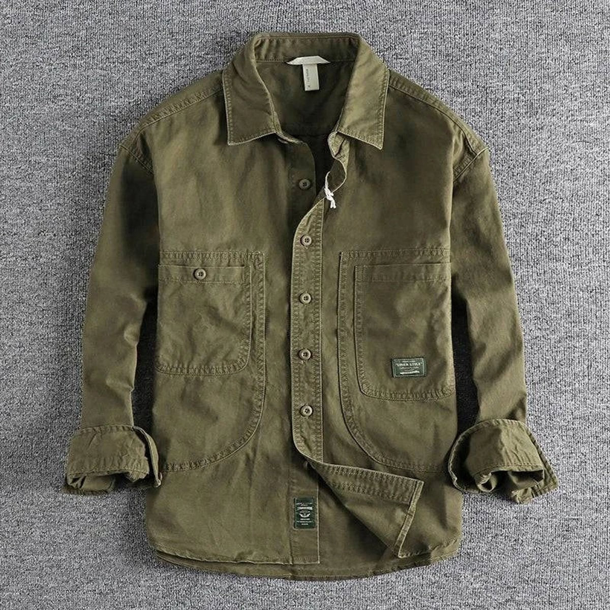 Olive green long-sleeve utility overshirt with buttoned patch pockets