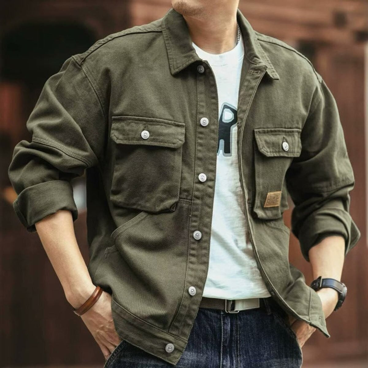 Khaki green cotton canvas utility jacket with button-flap chest pockets