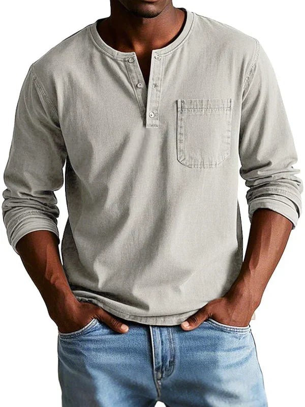 Light grey long sleeve Henley top featuring buttoned neckline and patch pocket