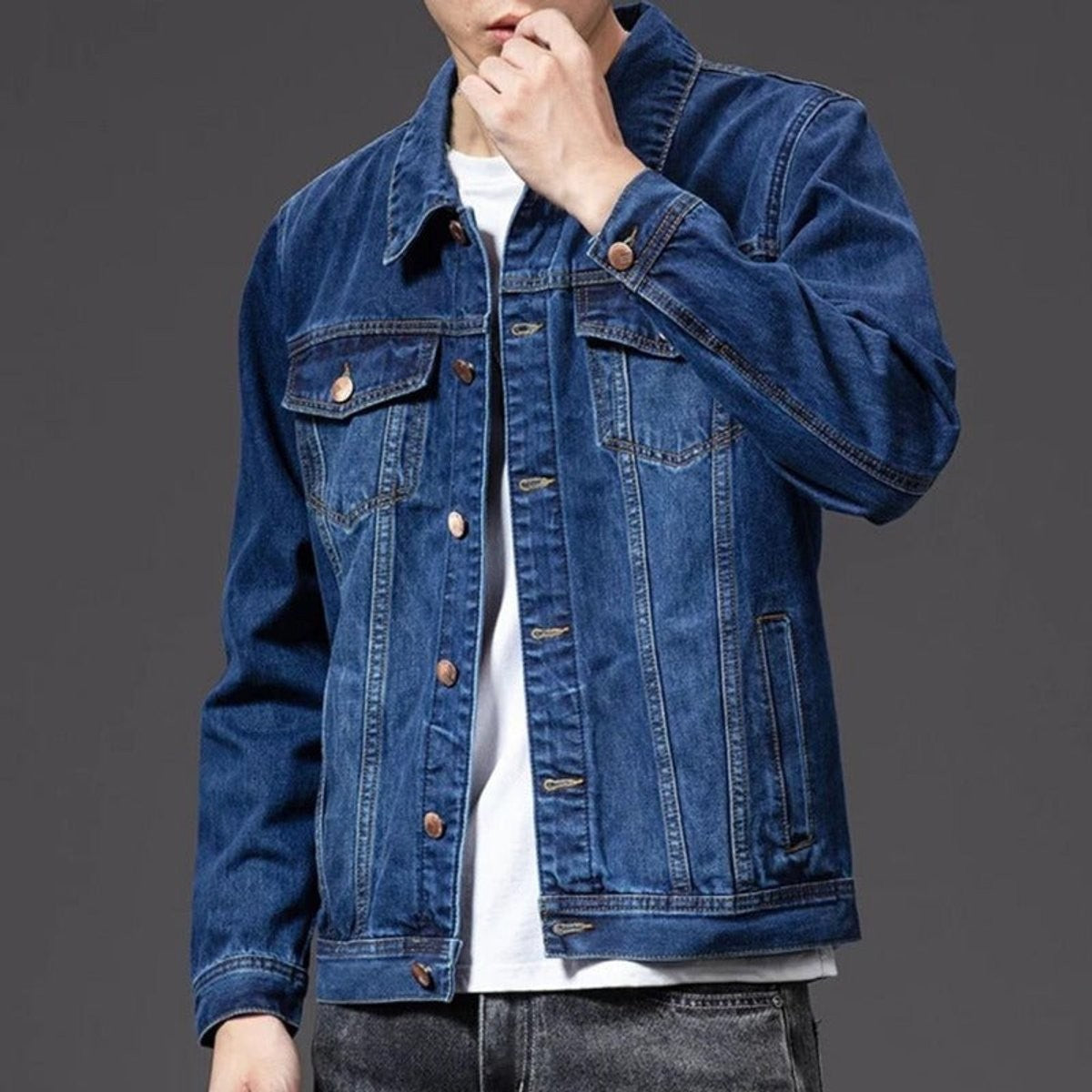 Men's casual denim jacket featuring point collar and copper-tone buttons