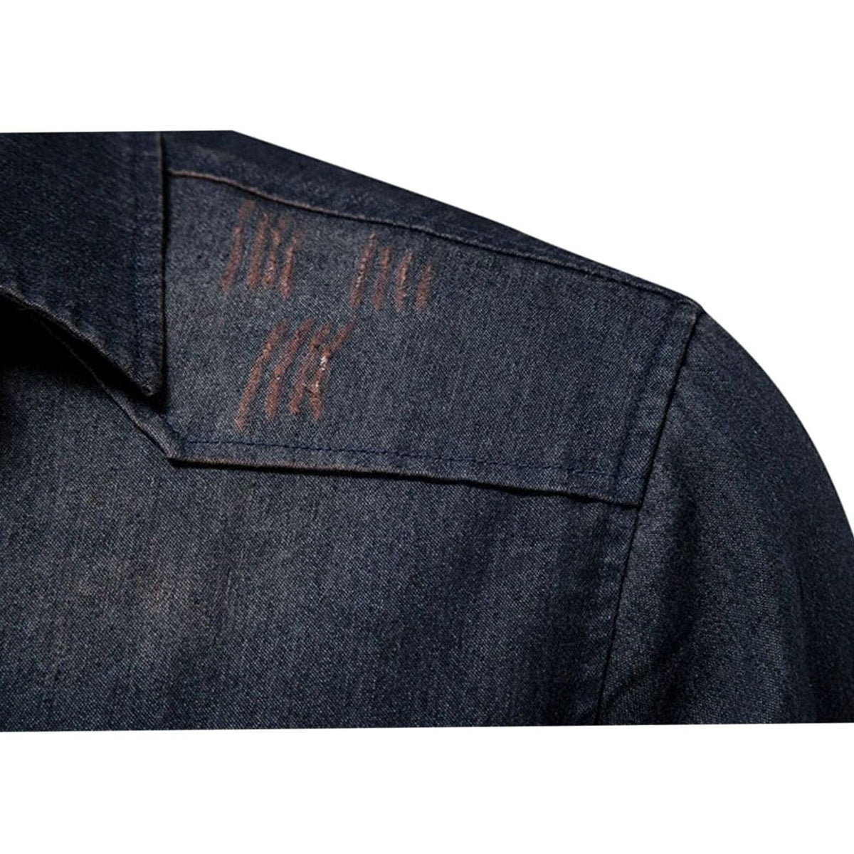 Close-up of denim shoulder yoke with faded whisker distressing detail