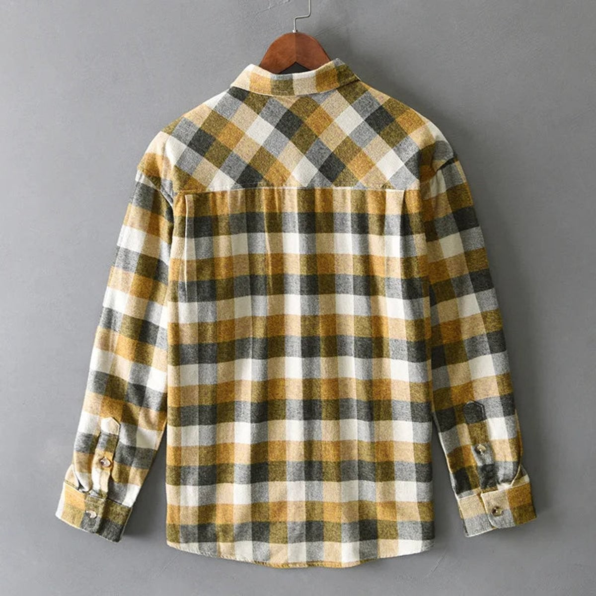 Rear view of mustard check flannel shirt showing yoke seam and relaxed fit