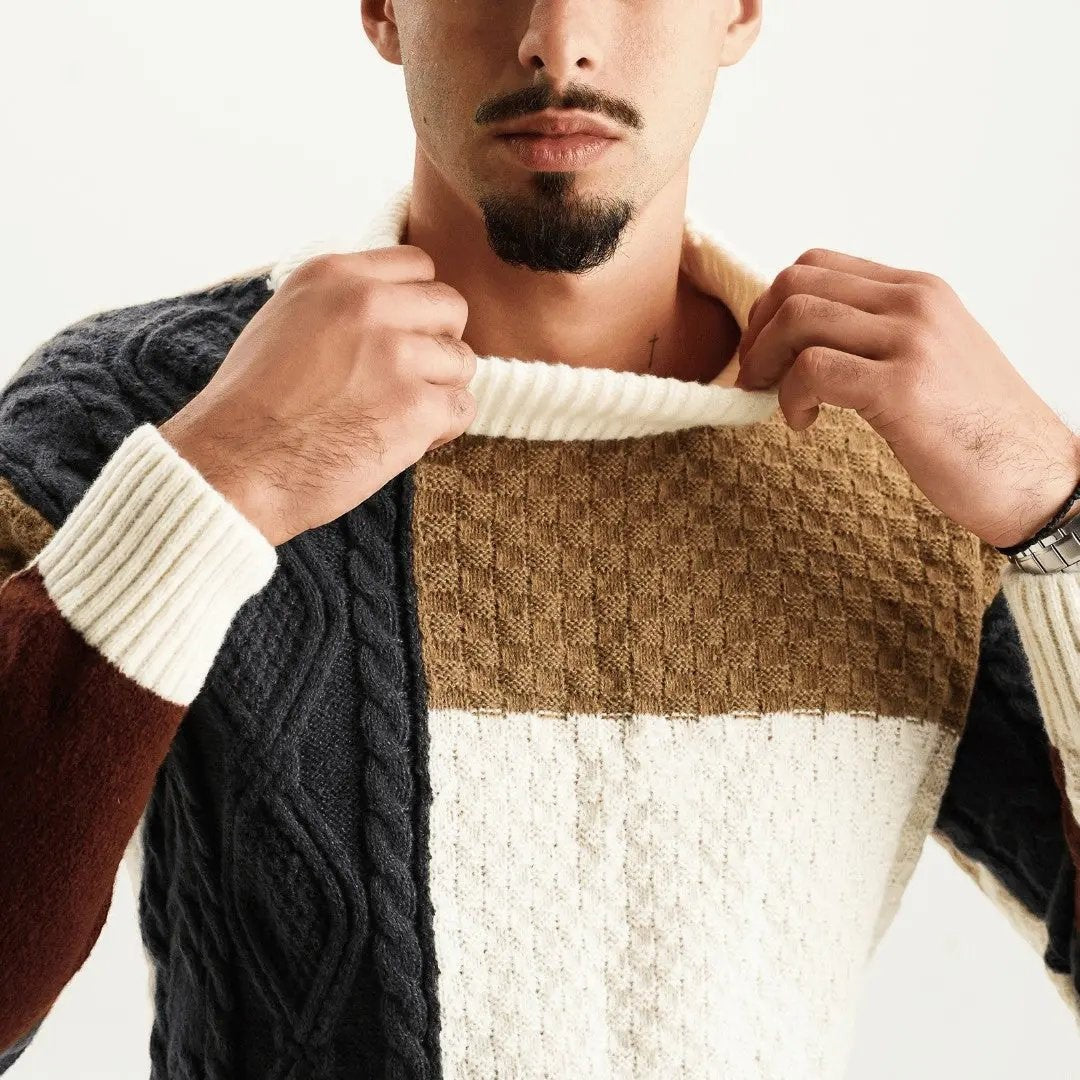 Close-up of ribbed turtleneck collar on colour-block cable knit jumper