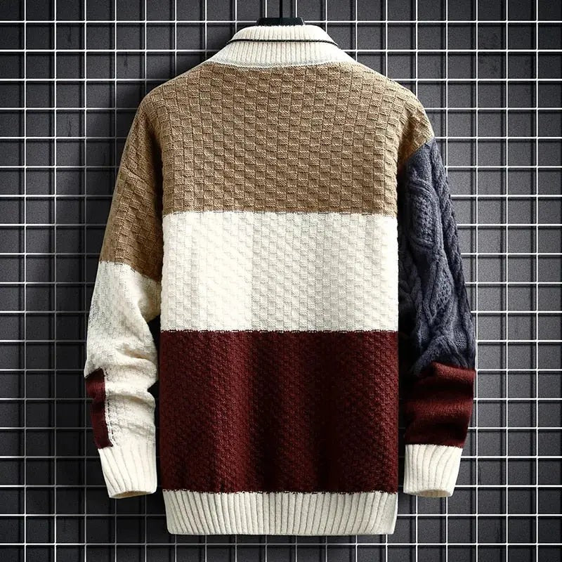 Back view of colour-block cable knit jumper showing textured panel design