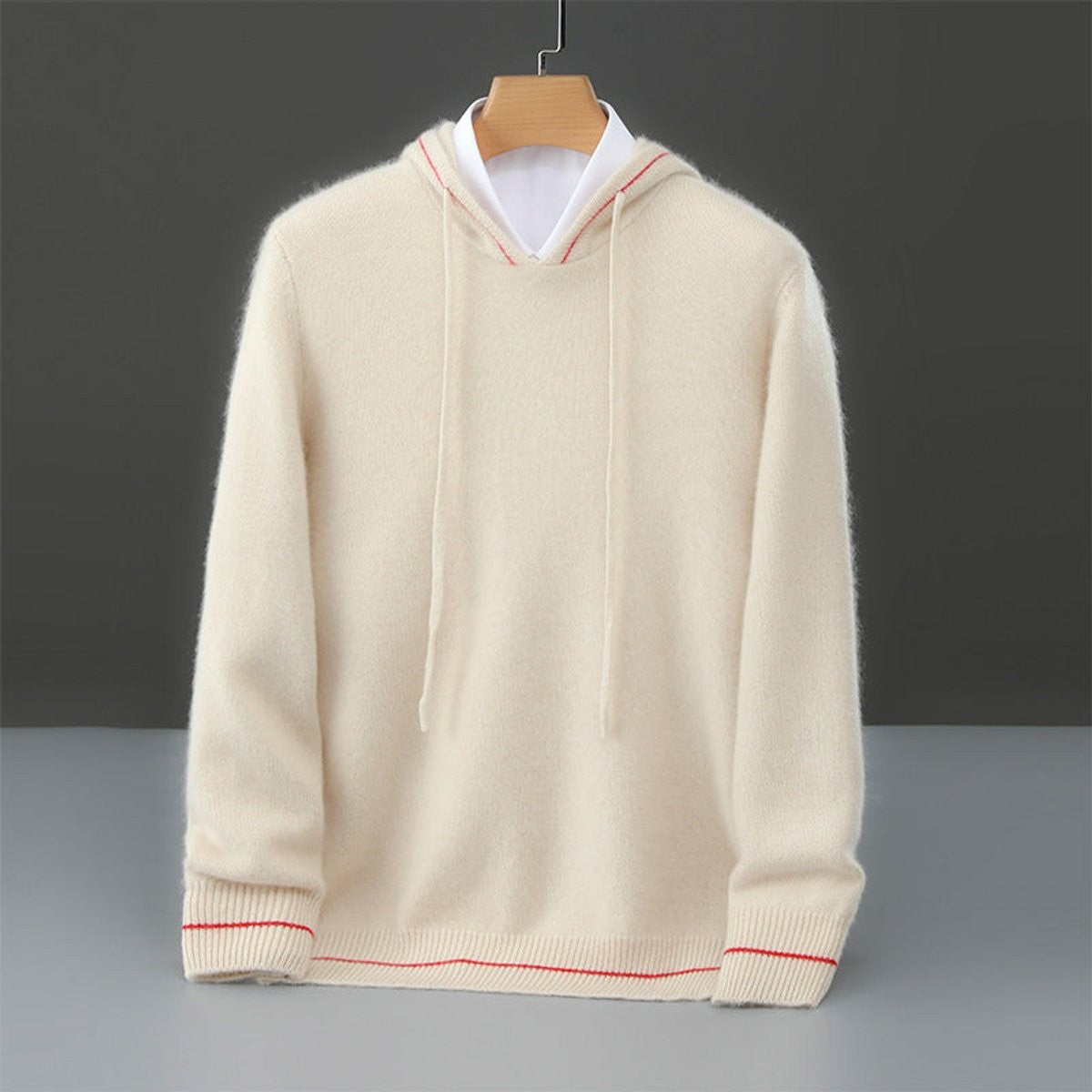 Cream cashmere hooded pullover featuring contrast red stripe detailing on cuffs
