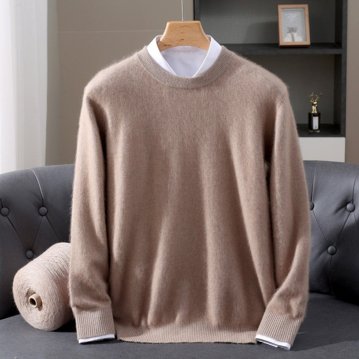 Beige soft knit crew-neck jumper layered over white shirt collar
