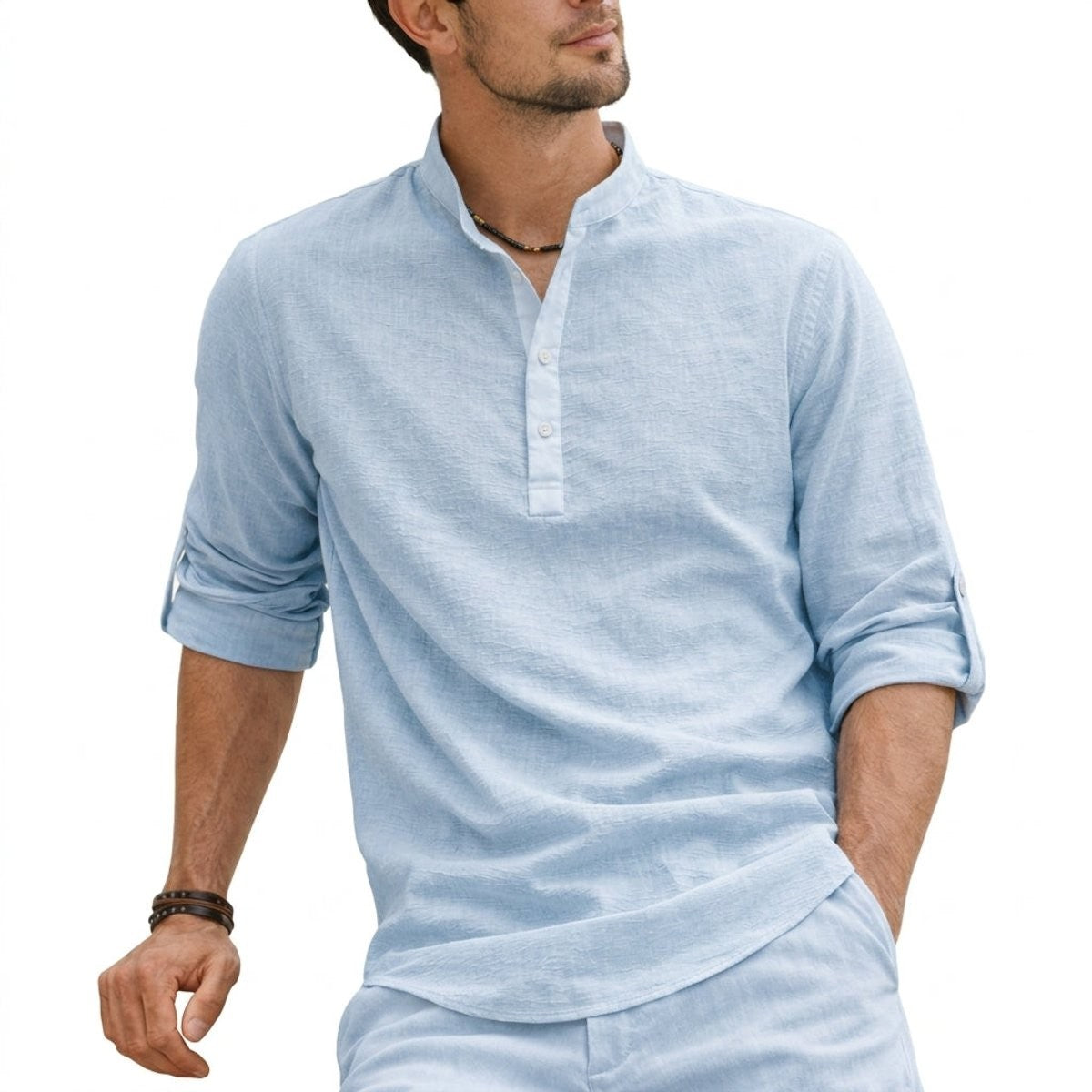 Pale blue linen henley shirt featuring grandad collar, worn casually