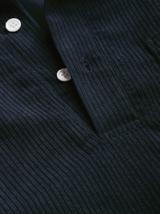 Close-up of navy corduroy collar and button placket detail
