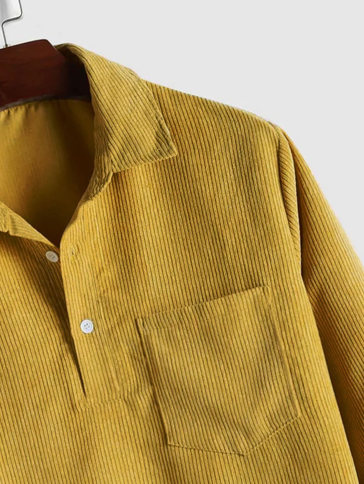 Close-up of mustard yellow corduroy collar and chest pocket