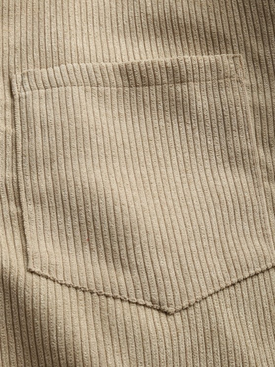 Close-up of beige corduroy chest pocket detail