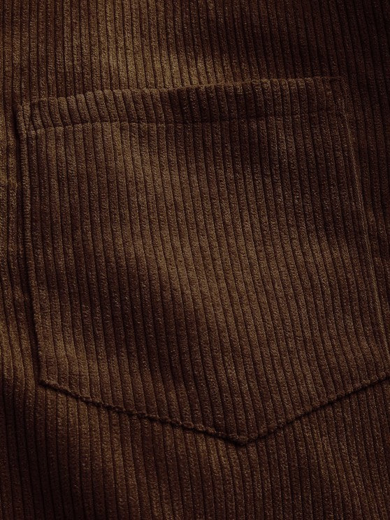 Close-up of olive brown corduroy chest pocket texture