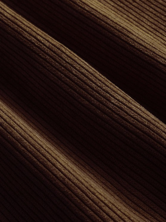 Close-up of olive brown corduroy ribbed fabric texture