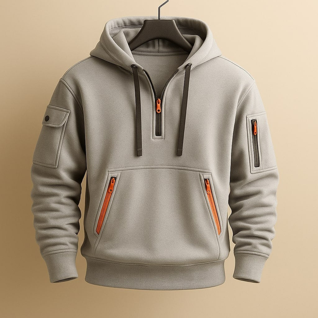 Grey half-zip hoodie showing dual kangaroo pockets with orange zips