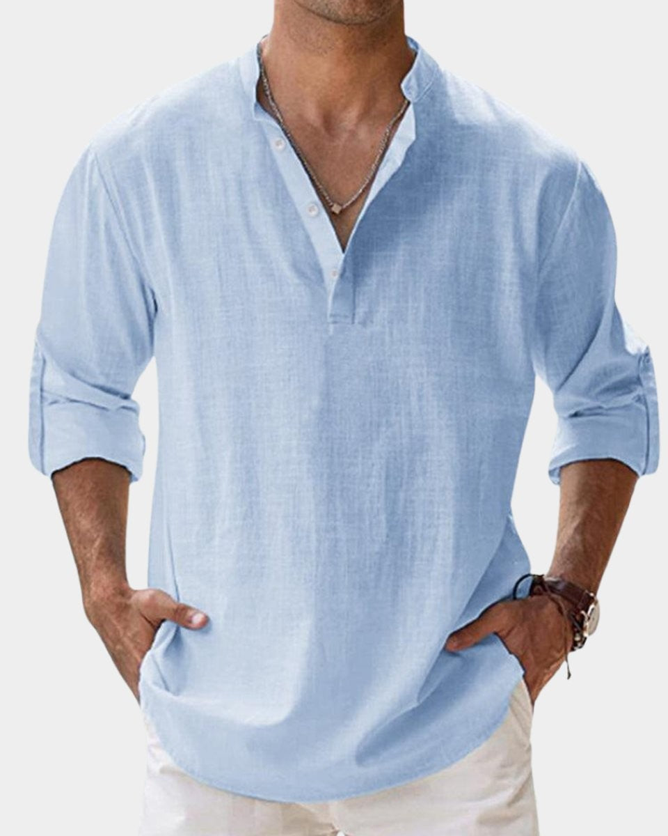 Pale blue linen Henley shirt featuring buttoned placket and relaxed fit
