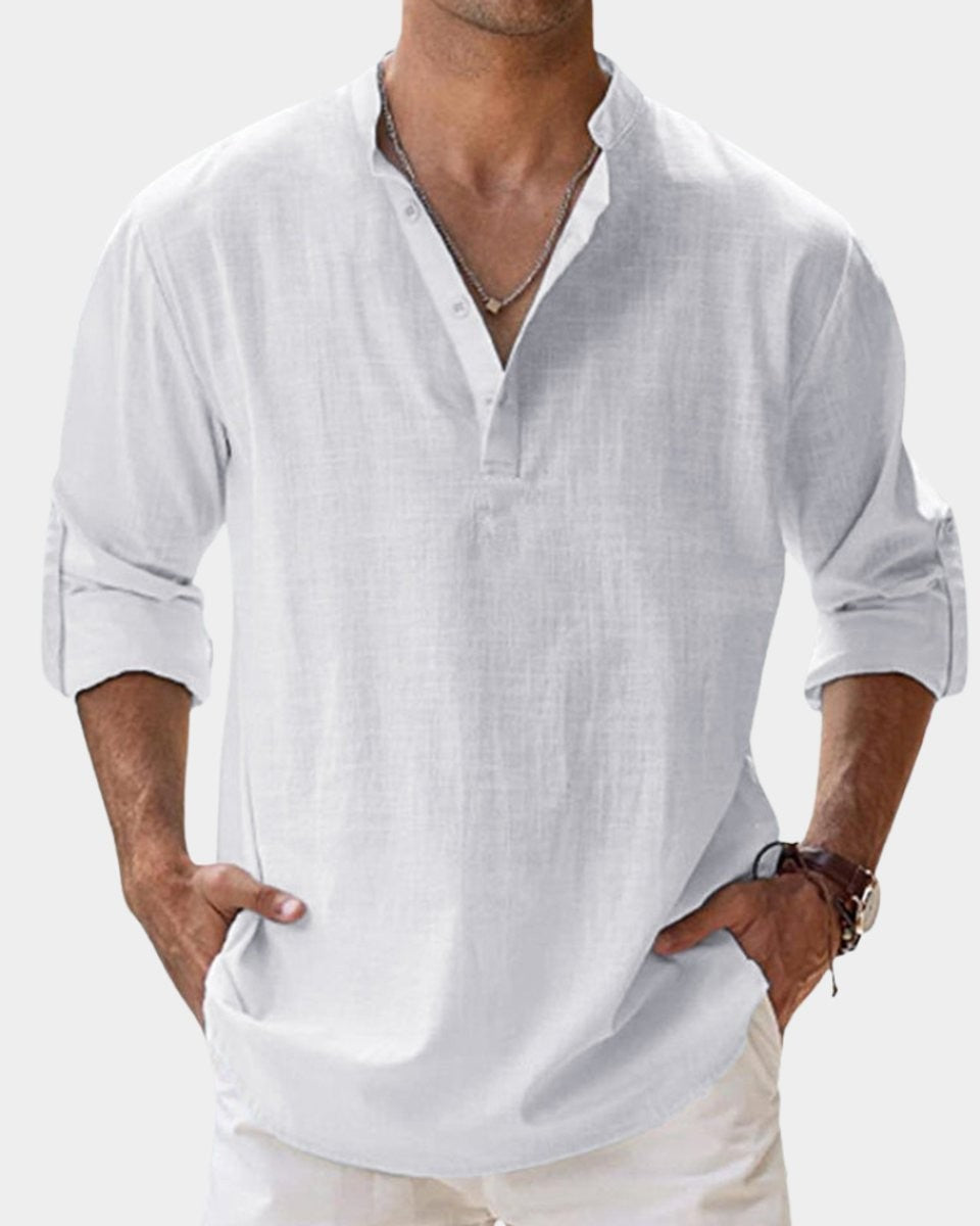 White linen Henley shirt showing buttoned V-neck and long sleeves