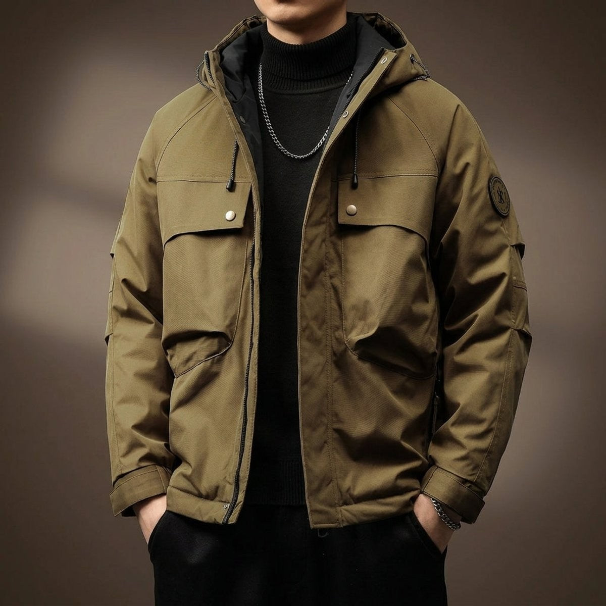 Khaki hooded utility jacket featuring chest pockets and adjustable cuffs