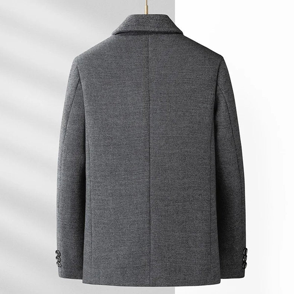 Rear view of grey blazer jacket showing tailored back seam and cuffs
