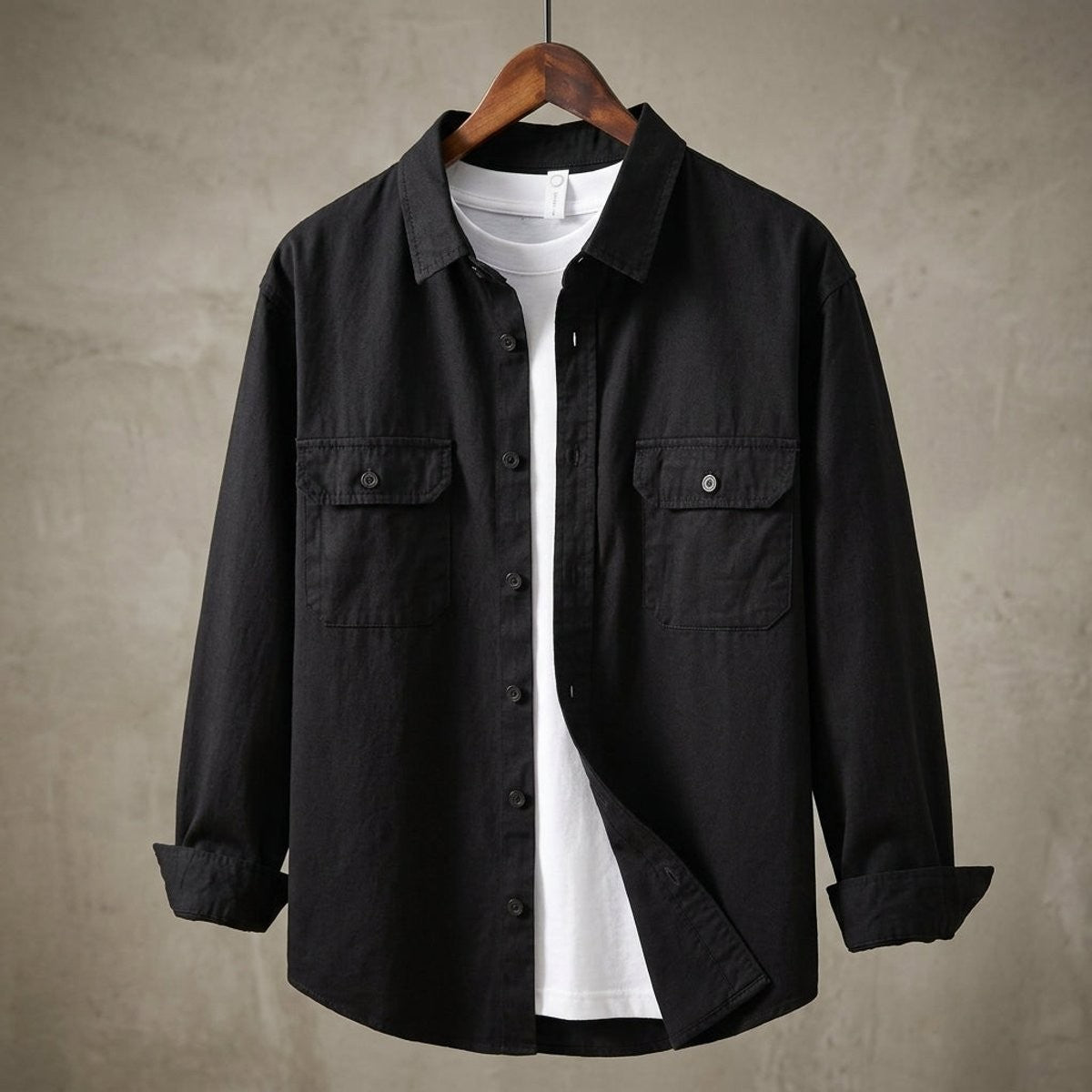 Black flannel overshirt featuring button-down collar and dual flap pockets