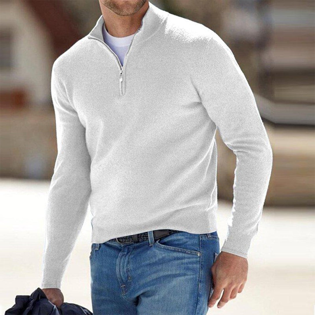 White quarter-zip jumper worn with denim jeans, men's knitted casual style